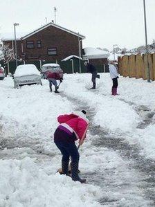 Fans dig their way through the snow ready for Wembley