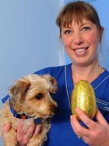 Poppy and vet nurse Karen Jones with an Easter egg