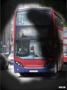 A bus as seen through a pair a special glasses used to simulate the vision experience by a partially sighted person