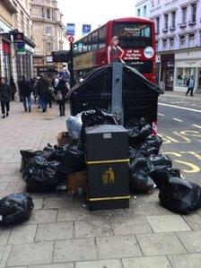 Overflowing rubbish bin in Brighton