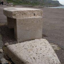 Damaged memorial bench