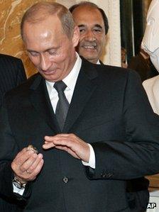 File photo of President Vladimir Putin with diamond-encrusted Super Bowl ring