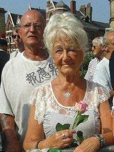 Eunice Goddard from Bury holding a flower