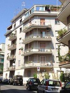 Priebke's apartment building in Rome with the military van parked outside