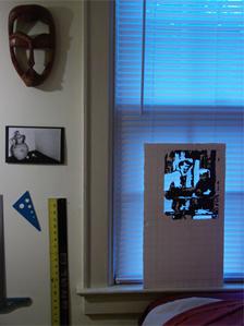 Mike's room with painting on the window sill and wooden mask from Sierra Leone