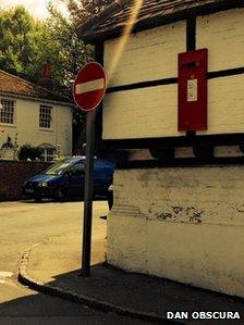 Postbox fascia on side of Bull Inn