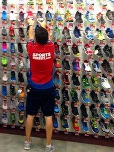 Sports Direct staff member organises trainers