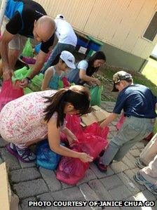 People packing supplies to distribute in northern Cebu