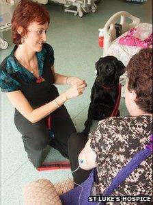 Comet with St Luke's senior receptionist Jenny Nicol and a hospice patient