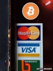 Bitcoin logo on shop door