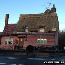 Reindeer on thatched roof