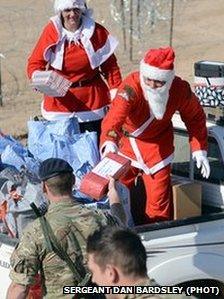 Troops from 3rd Regiment the Royal Artillery receive presents