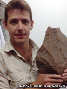 James Cole with a Stone Age handaxe