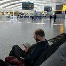 Man waiting at Heathrow airport April 2010