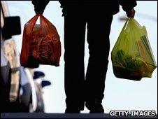 Man carrying plastic bags