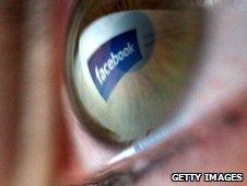 Facebook logo reflected in eye