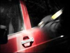 Person breaking into a vehicle