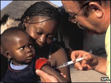 A baby receives a vaccine