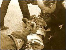 Fr Daly gives the last rites to one of the victims of Bloody Sunday