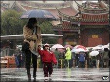 File image of a mother and son at a Taipei temple on 17 February 2010