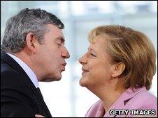 Gordon Brown zooming in to kiss Angela Merkel on the cheek ahead of a G20 preparatory meeting in Berlin on 22 February, 2009