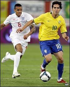 Jermaine Jenas of England chases Brazil's Kaka