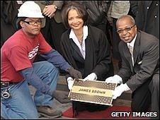 Workman with theatre president Jonelle Procope, centre, and historian Billy Mitchell