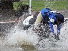 Kristina Cook of Great Britain falls on day three of the Badminton Horse Trials on May 2, 2010 in Badminton