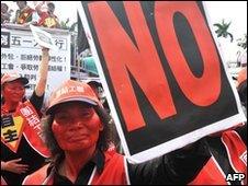 Protesters hold banners in Taipei