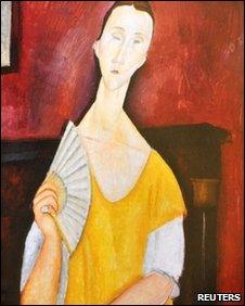 A reproduction of La Femme a l'Eventail (Woman with Fan) painted in 1919 by Amedeo Modigliani