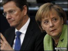 German Chancellor Angela Merkel (r) and Foreign Minister Guido Westerwelle in parliament, 21 May 2010