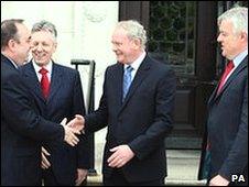 Northern Ireland First Minister Peter Robinson (second left) with Deputy First Minister Martin McGuinness (centre) welcome Scottish First Minister Alex Salmond (left) and the Welsh First Minister Carwyn Jones, to Parliament buildings at Stormont.