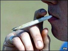 A man smoking cannabis cigarette