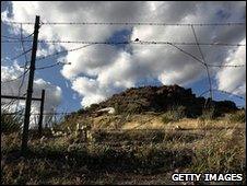 A barbed wire fence along the US-Mexico border at Montezuma Pass, Arizona, file pic from 2 May 2010