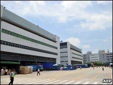 Staff walk at the giant Foxconn complex in Shenzhen, China, on 26 May 2010