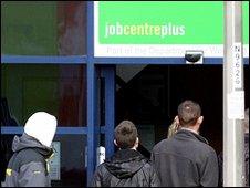 People outside a Job Centre Plus building