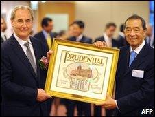 Prudential chairman Harvey McGrath (L) and Ronald Arculli, chairman of the Hong Kong Exchange