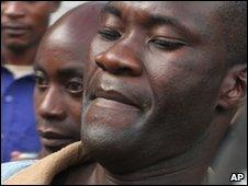 Tiwonge Chimbalanga, right, and Steven Monjeza, middle, are led from court in Blantyre on 20 May 2010