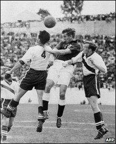 English midfielder Tom Finney (C) tries to head the ball between US defenders Charlie Colombo and Walter Bahr, 29 June 1950