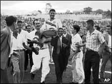 Joe Gaetjens (C) is carried off the pitch by cheering fans after US win, 28 June 1950