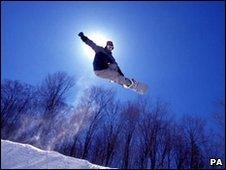 Snowboarder jumping in mid air