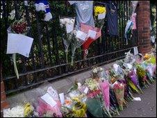 Flowers have been left at the scene of the shooting on the Shankill Road