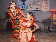 Pinky (kneeling) taking part in a dance routine