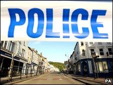 Police tape seals off a street in Whitehaven