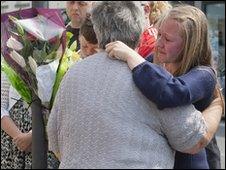 Relatives of Darren Rewcastle visit the scene of his murder