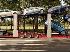 Cars loaded on to transporting lorry