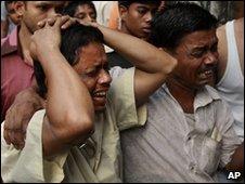 Mourner at the scene of the fire