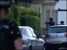 Armed police enter the house