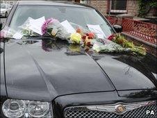 Floral tributes left on Stuart Cable's car