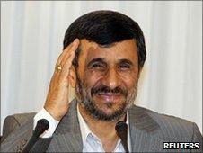 Iranian President Mahmoud Ahmadinejad gestures after his news conference in Istanbul